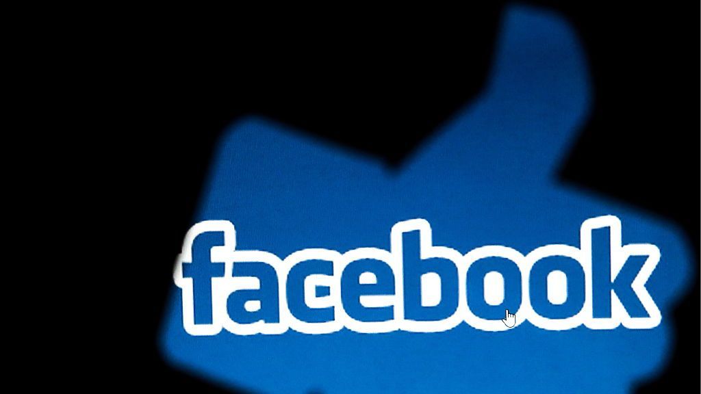 ST PETERSBURG RUSSIA NOVEMBER 16 2016 A Facebook sign seen through a thumbsup shaped cutout. Sergei KonkovTASS