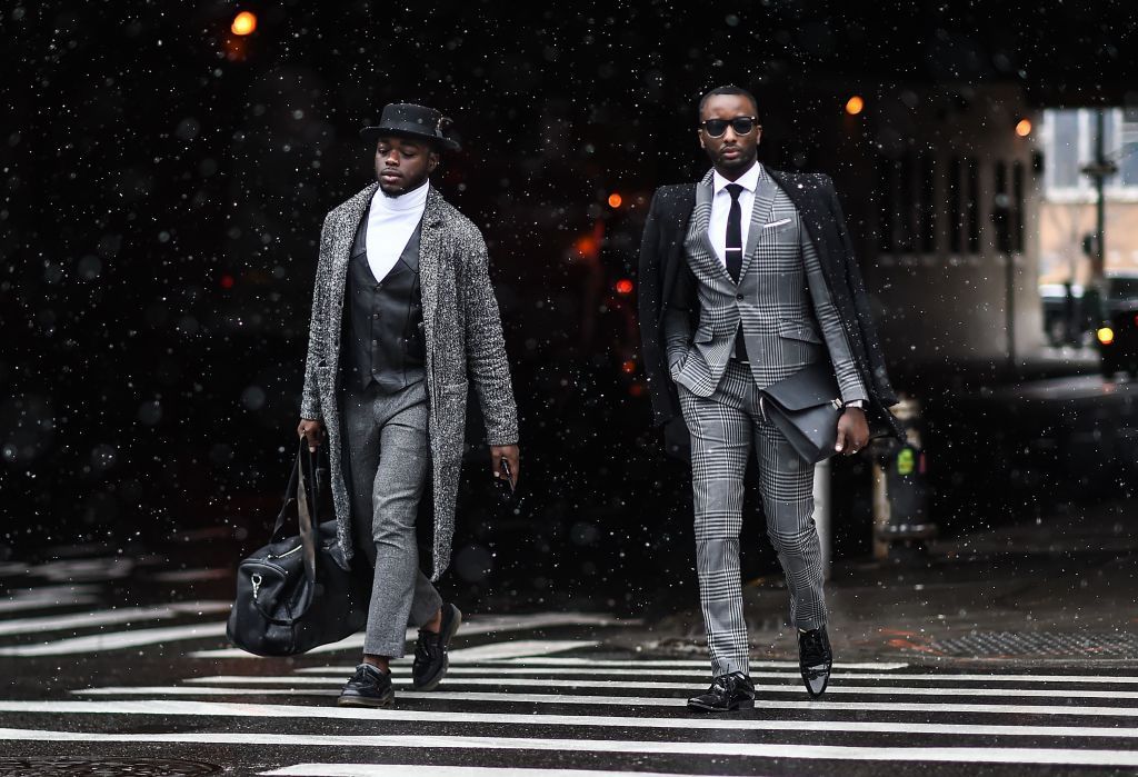 NEW YORK NY JANUARY 31 A group of guests are seen wearing a gray striped suits outside of the Carlos Campos show...