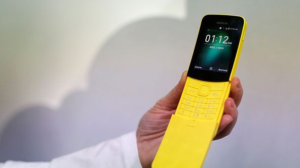 A man holds a Nokia 8110 mobilephone at the Mobile World Congress the world's biggest mobile fair on February 26 2018...