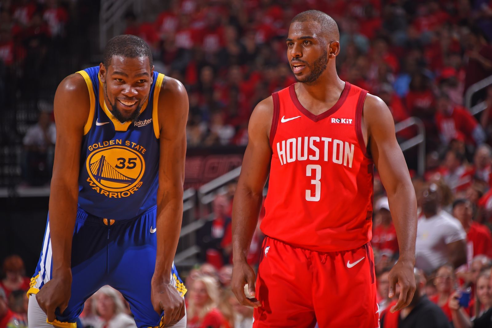 HOUSTON TX MAY 6 Kevin Durant 35 of the Golden State Warriors and Chris Paul 3 of the Houston Rockets smile during Game...