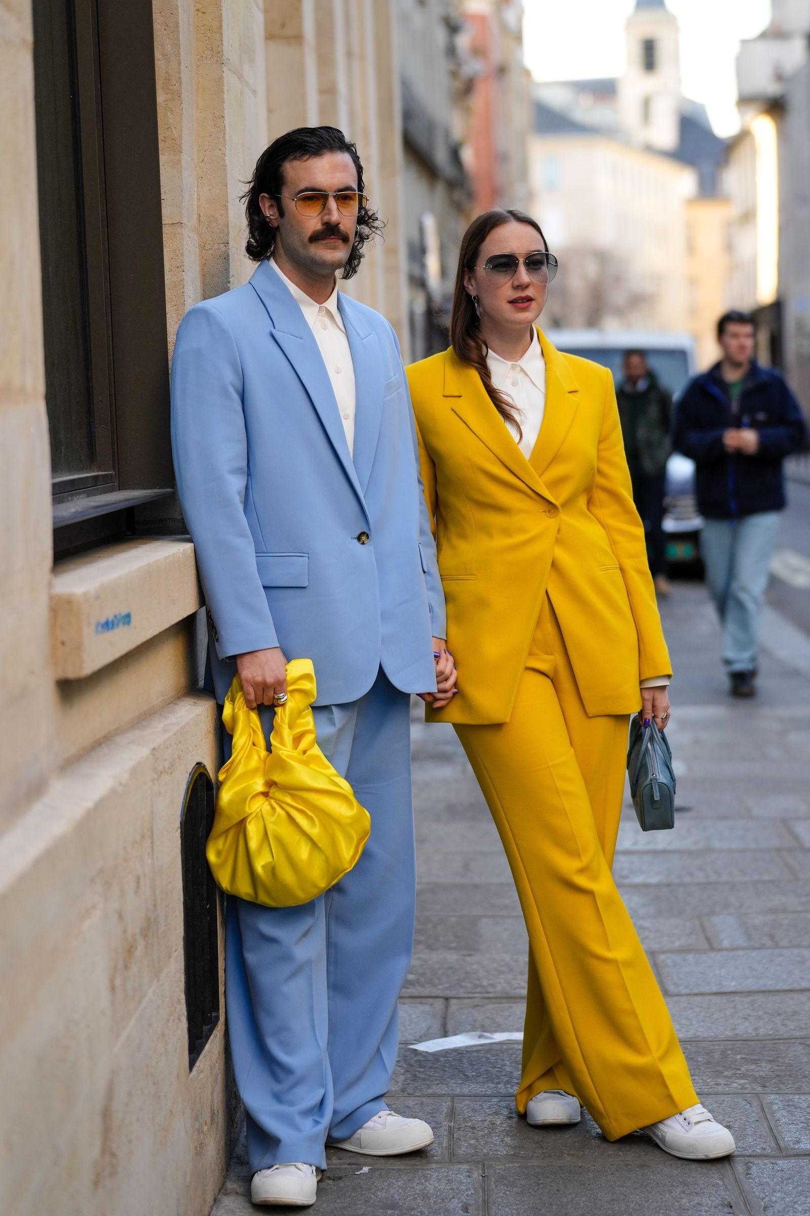 PARIS FRANCE FEBRUARY 28 A guest wears sunglasses a white shirt a pale blue blazer jacket matching pale blue suit...
