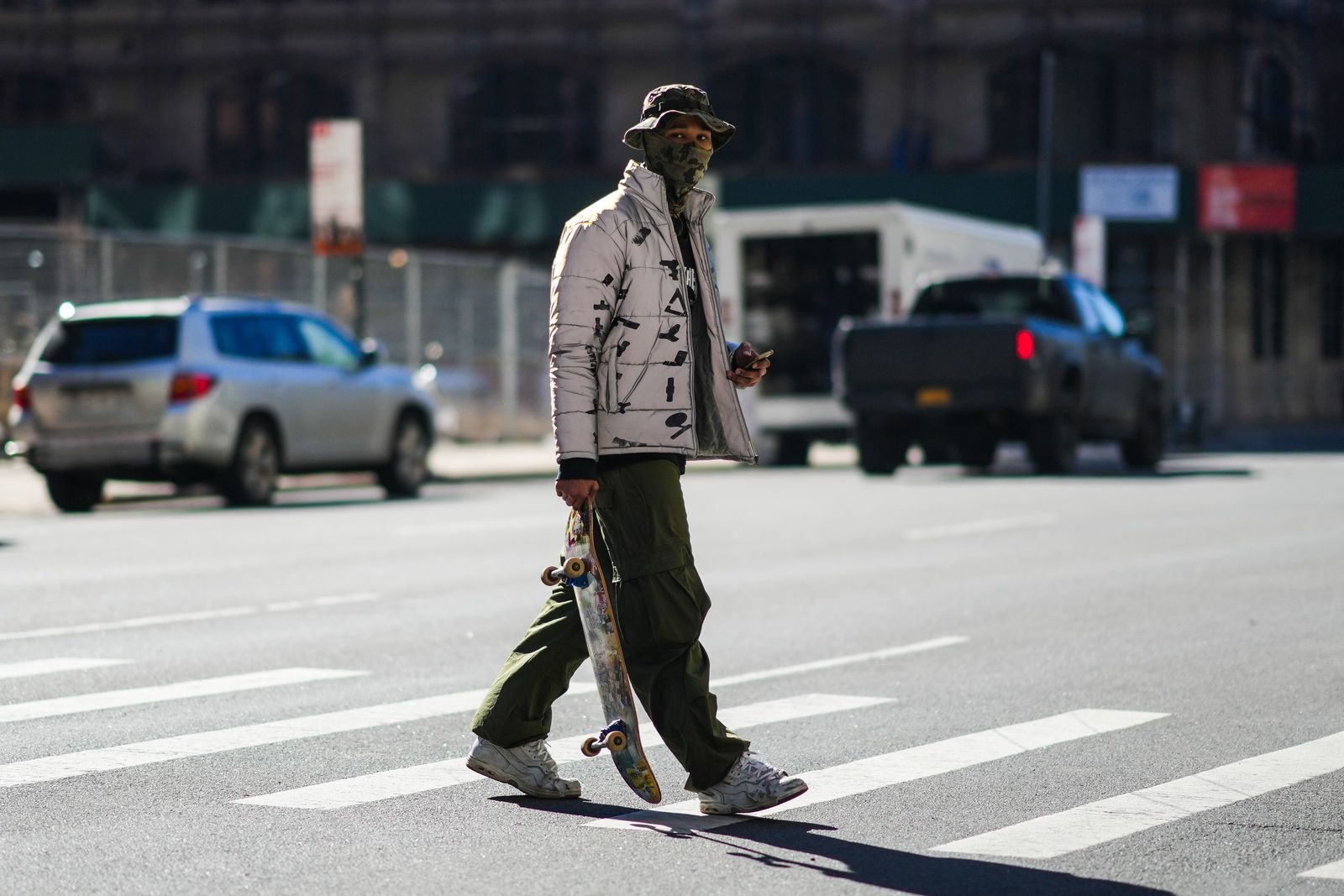 NEW YORK NEW YORK FEBRUARY 11 A guest wears a khaki and black military print pattern bob a khaki military print pattern...