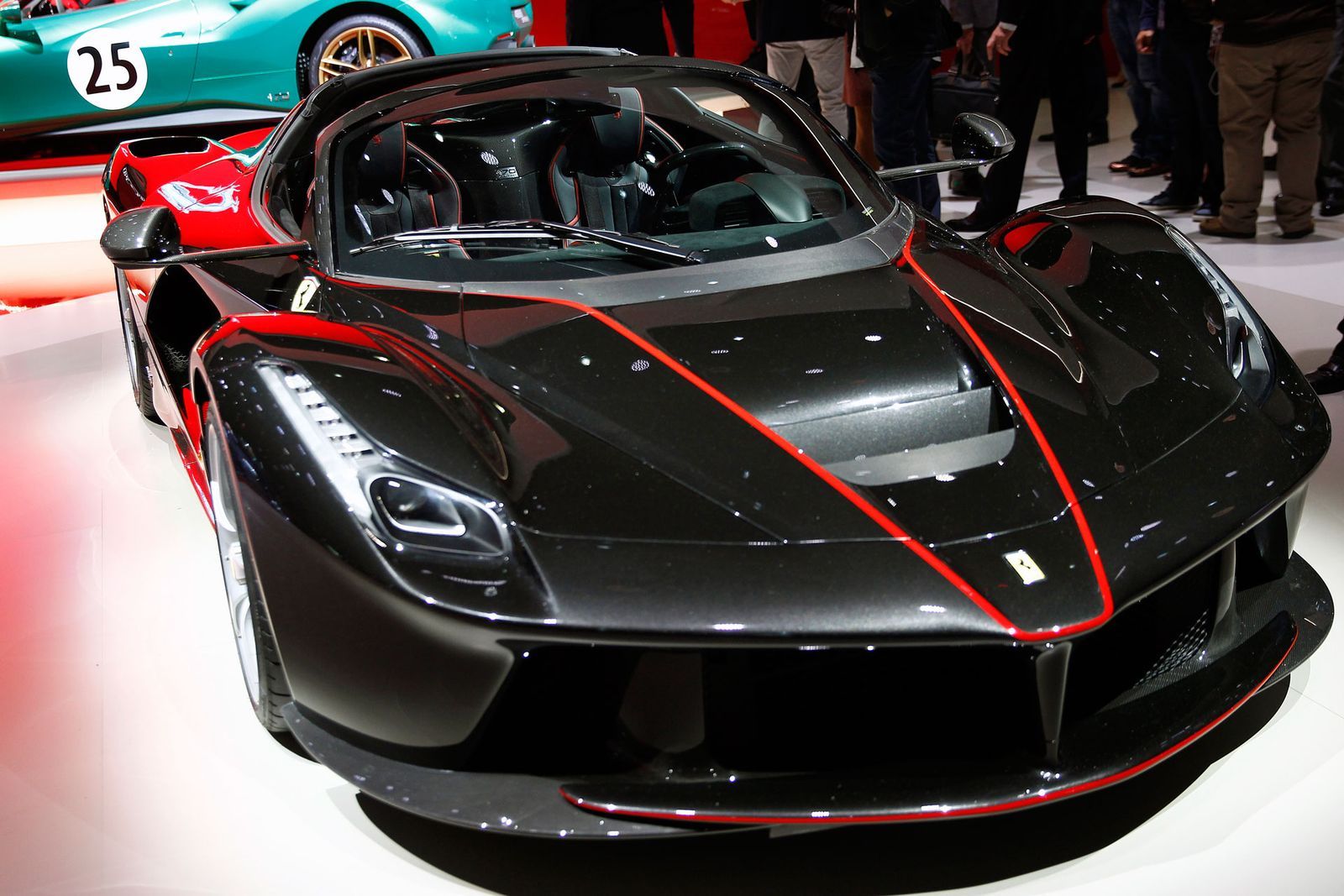 Image may contain Vehicle Transportation Automobile Car Show Car Human Person Wheel Machine and Sports Car