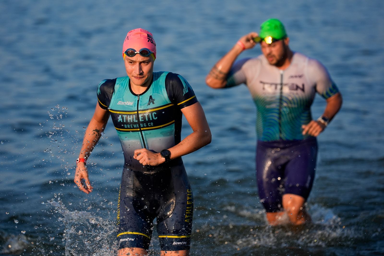 MUNCIE INDIANA JULY 13 Age group athletes exit the swim course at the 2024 IRONMAN 70.3 Muncie on July 13 2024 in...