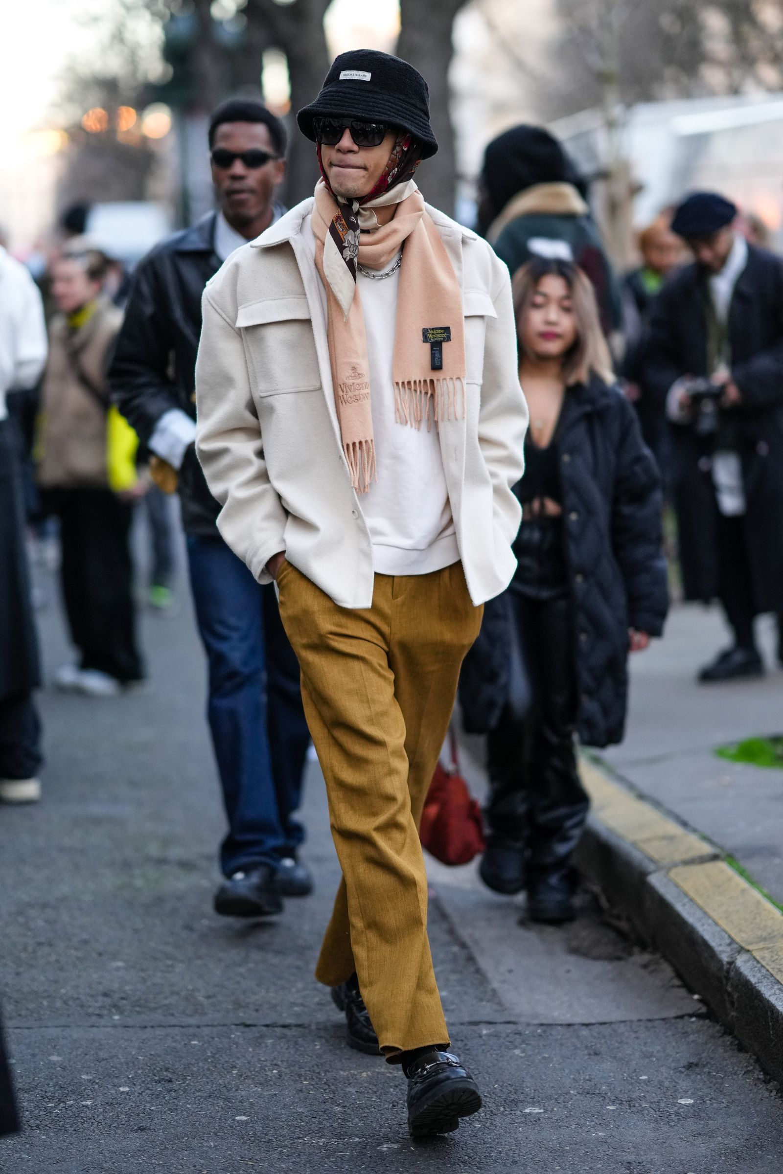 PARIS FRANCE JANUARY 21 A guest wears a black bob hat a red brown white flower print pattern silk scarf as a head...