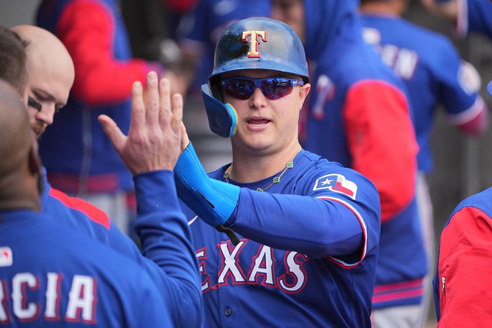 CHICAGO IL MAY 24 Joc Pederson 4 of the Texas Rangers celebrates in the dugout during the game between the Texas...