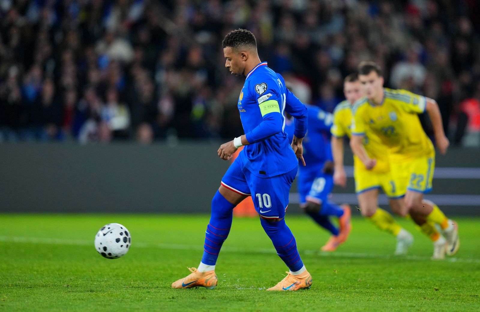 PARIS FRANCE NOVEMBER 13 Kylian Mbappe of France scores his team's first goal from the penalty spot during the FIFA...