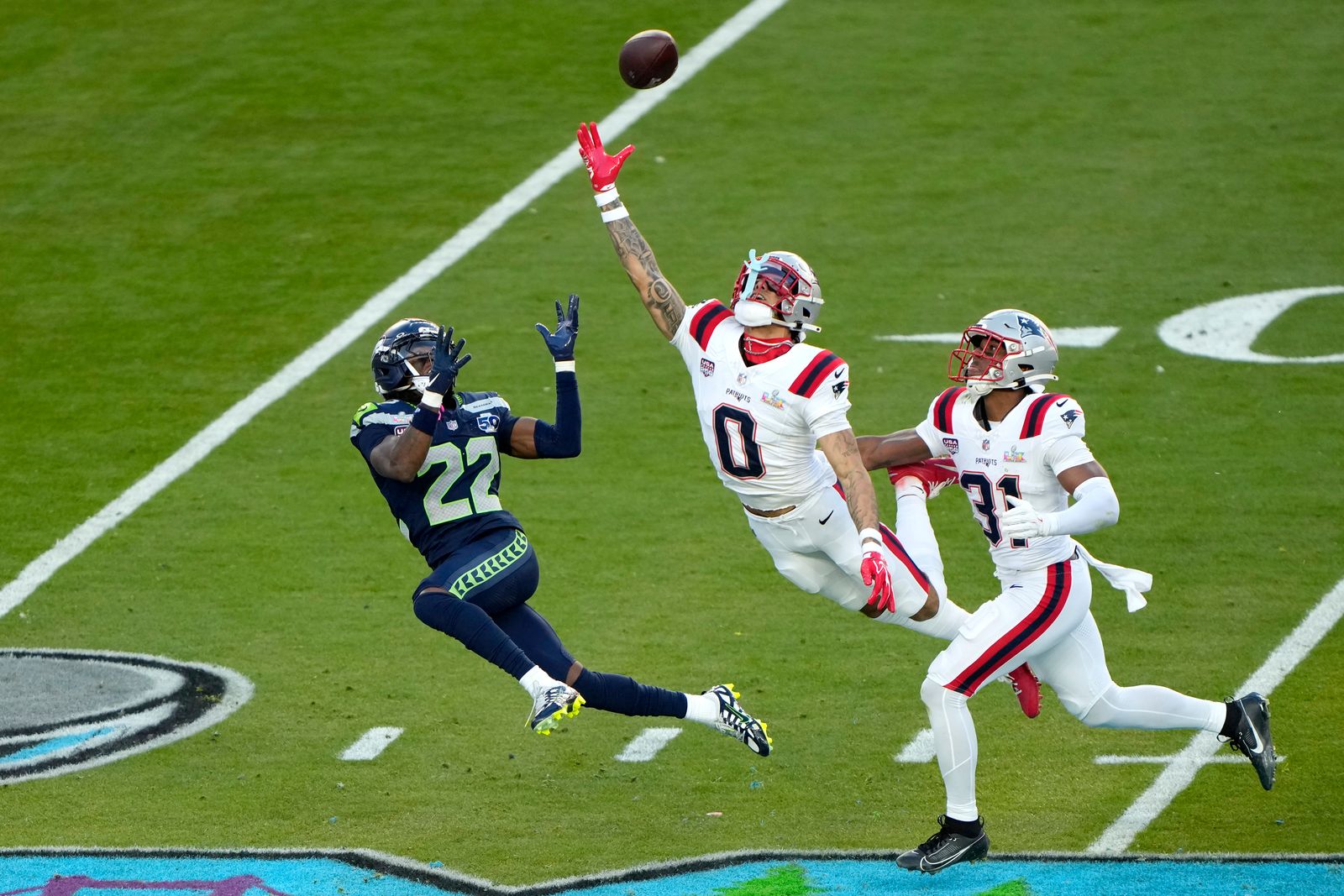 SANTA CLARA CALIFORNIA FEBRUARY 08 Christian Gonzalez 0 of the New England Patriots breaks up a pass intended for for...