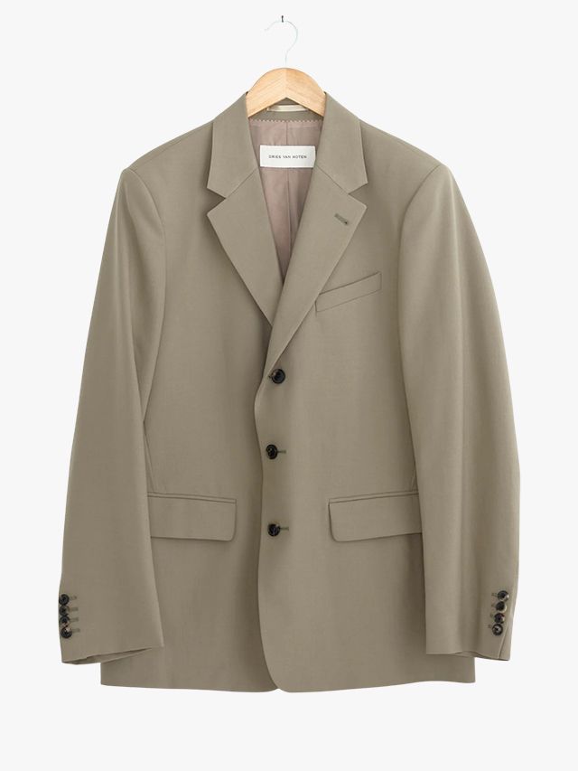 Image may contain Blazer Clothing Coat Jacket Formal Wear Suit and Khaki