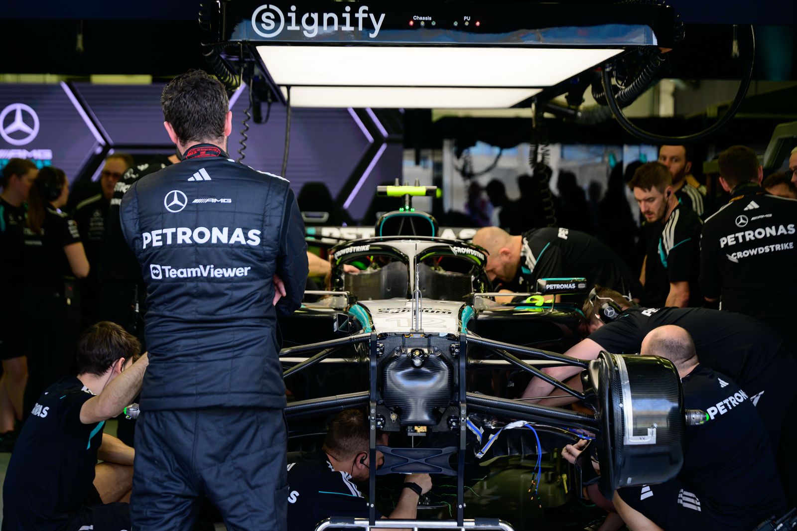 In Sakhir Bahrain on February 12 2026 team mechanics work on the car of Andrea Kimi Antonelli of the MercedesAMG...