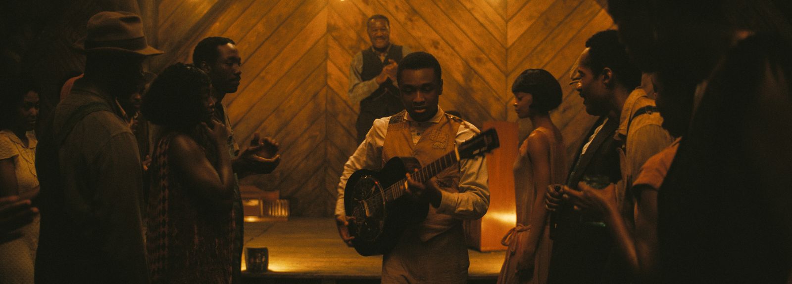 Image may contain Delroy Lindo Adult Person Guitar Musical Instrument Guitarist Leisure Activities and Music