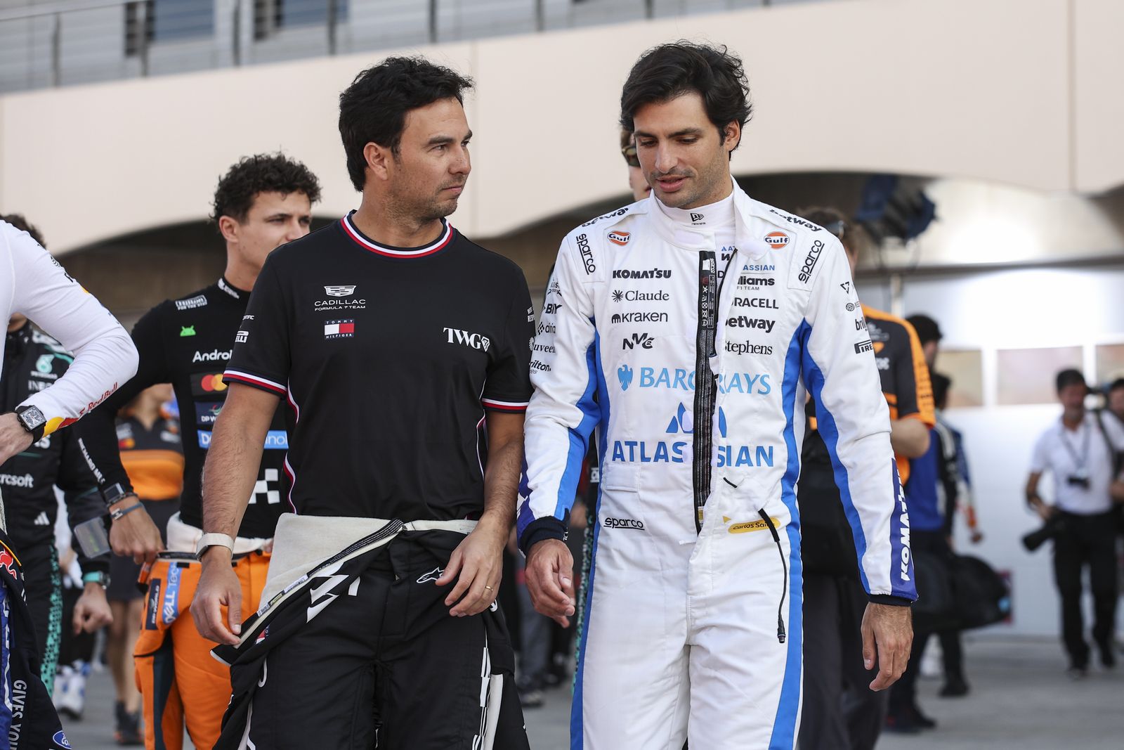 Sergio Perez of the Cadillac F1 Team and Carlos Sainz of the Williams F1 Team are seen ahead of the preseason tests for...